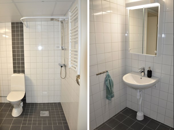 Badrum med vitt och grått kakel, toalett, handfat, spegelskåp och en duschhörna